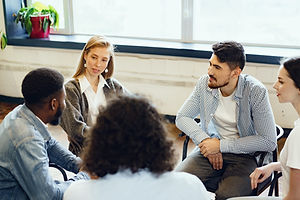 young-people-sitting-in-a-circle-and-having-a-discussion-scaled.jpg