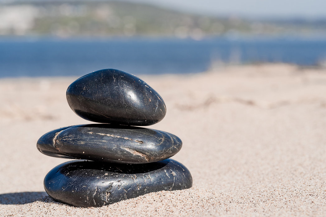 Zen-composition-of-pebbles-on-the-sea-sa