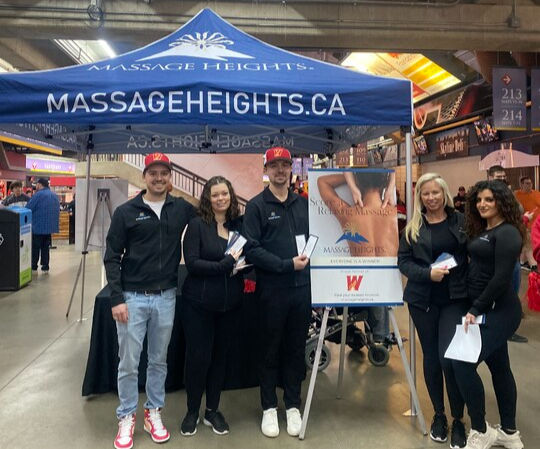 Massage Heights team at an event promoting their practice