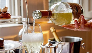 #16. 04-10-2024. Cashel Palace Hotel Gift Vouchers. Incorrect etiquette, no wine service-cloth is shown to compliment the sparkling wine on ice?