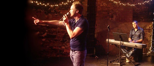 Photo of Cabaret Showdown host Mark McDaniels with Assaf Gleizner on the keys