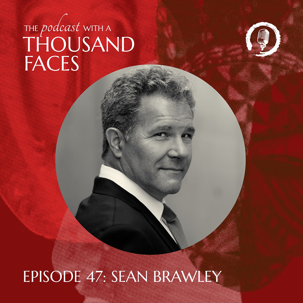 Man in suit smiling on a red patterned background. Text: "The Podcast with a Thousand Faces, Episode 47: Sean Brawley" with microphone icon.