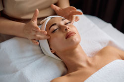 young-woman-having-facial-massage-treatment-beauty-salon