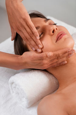 view-woman-getting-facial-yoga-massage-stay-young