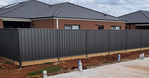 Colorbond fence with sleepers