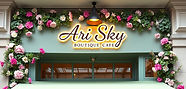 beautiful luxury store vibe boutique cafe entrance with accents of flowers and hummingbird