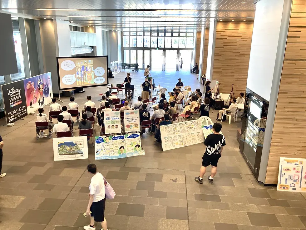 田島地区 自主防災会 堺さんによる話題提供。道行く方も立ち止まってご覧くださいました。