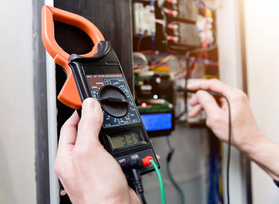 Voltmeter being used for electrical safety check