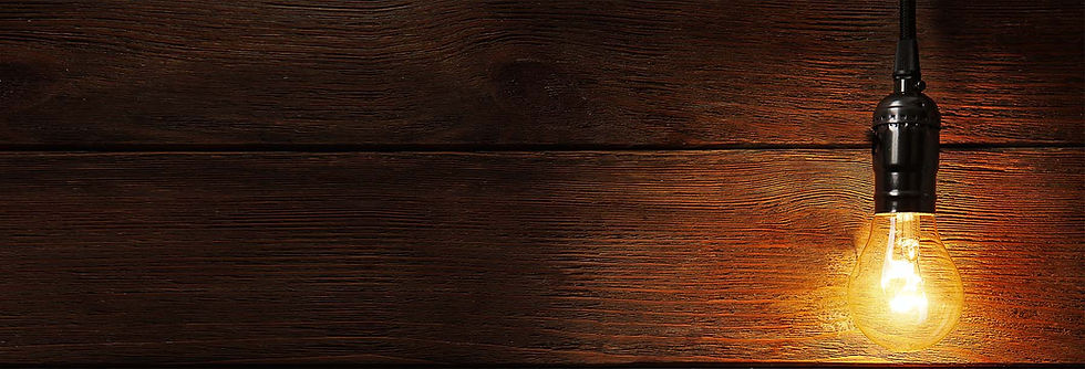 Electricians Pakenham website header yellow lightbulb on wooden planks.jpg
