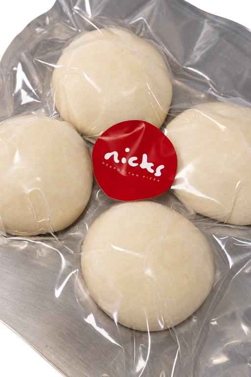 Four Nicks dough balls in a vacuum bag