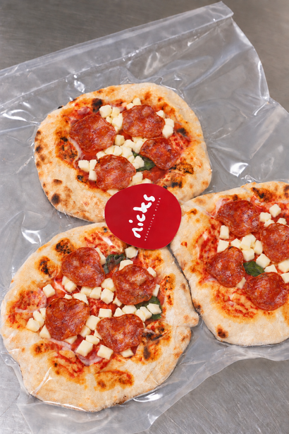Three Nicks mini Pepperoni pizzinis in a vacuum bag