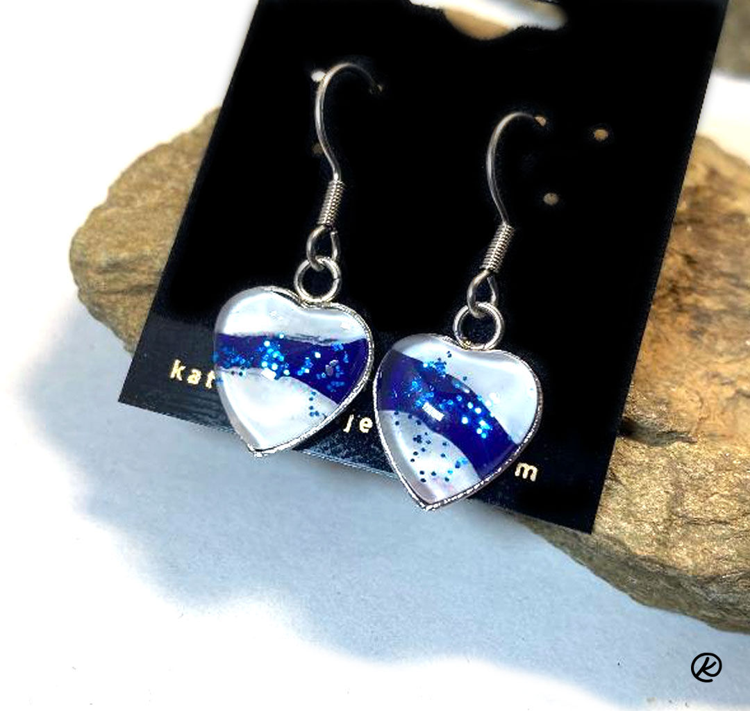 White and blue poured acrylics set into surgical steel