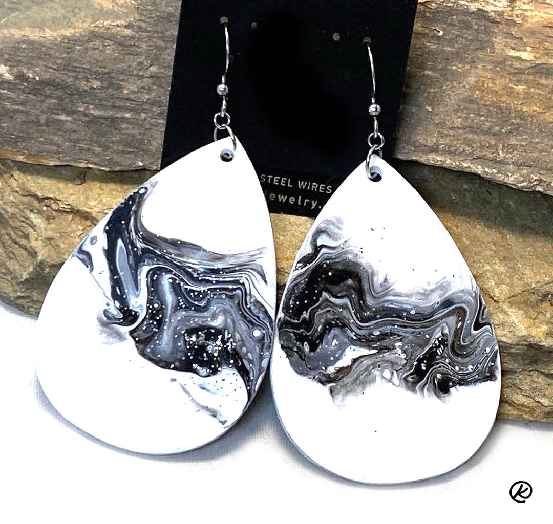 Black and white poured acrylics on balsa wood