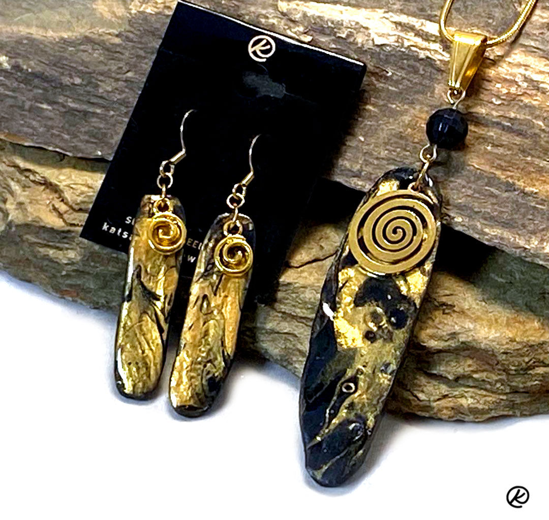Gold and black poured acrylics pendant on slate