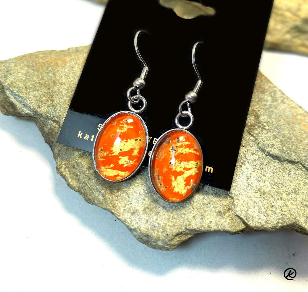 Small fiery earrings set into surgical steel