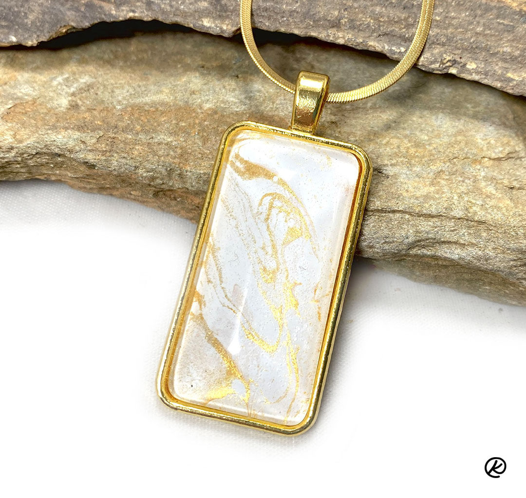 Medium sized gold and white poured acrylic pendant