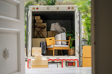the back of a truck carrying good moving house