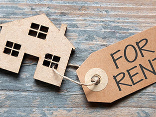 Miniature real estate house with for rent label