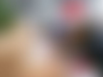 woman in Santa hat sorting boxes for food drive.