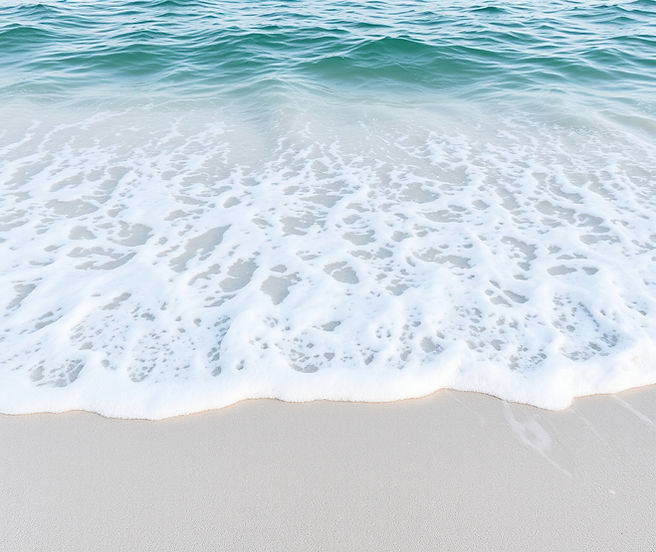 calm ocean waves coming ashore on white sandy beach.jpg