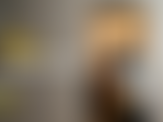 2 movers carrying a piece of furnture through a doorway that is protected by moverbuddy door protectors