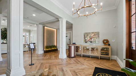 Elegant lobby with wood floor and chandelier
