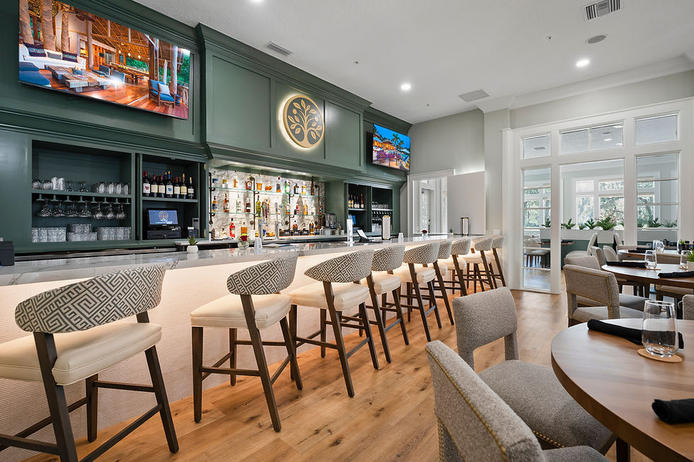 Interior bar at The Grove at Orange Park featuring Citrus Club seating, cocktail bar, and TVs for sports watch parties and social gatherings.