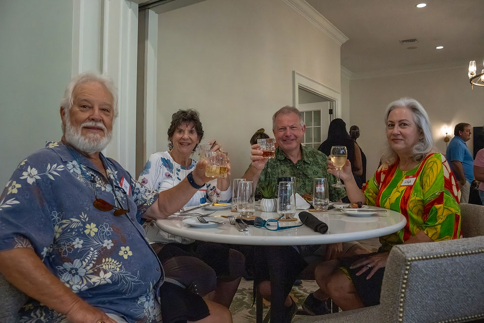 Members enjoying drinks together at The Grove during a social winter gathering inside the clubhouse.