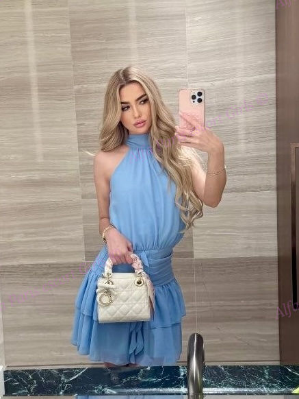 blonde in sky blue dress in Paris 