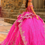 Thumbnail: Woman in pink Sherri Hill 55093 Sleeveless Straight Across Neckline prom Gown posing near stone building.
