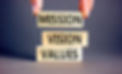 Mission vision values symbol. Concept words Mission Vision Values on wooden blocks on a be