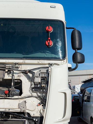 Front of a truck with the suction cup still attached to the windshield following its installation