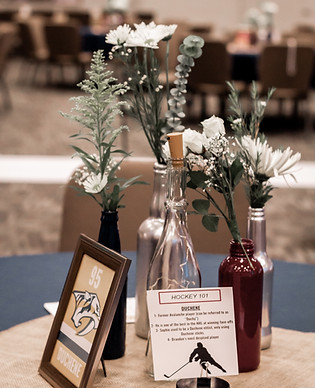 A wedding table set up that is hockey themed.