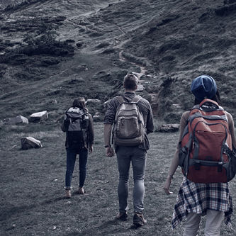 Group of six hikers climbing on peak together. They carrying rucksacks and following each other on their ascent in highland Von Yakobchuk Olena Adobe Stock