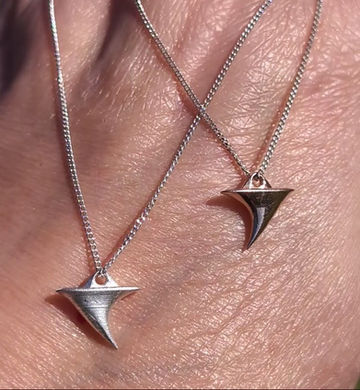 Thumbnail: a silver chain necklace with a solid cast Rose Thorn Charm