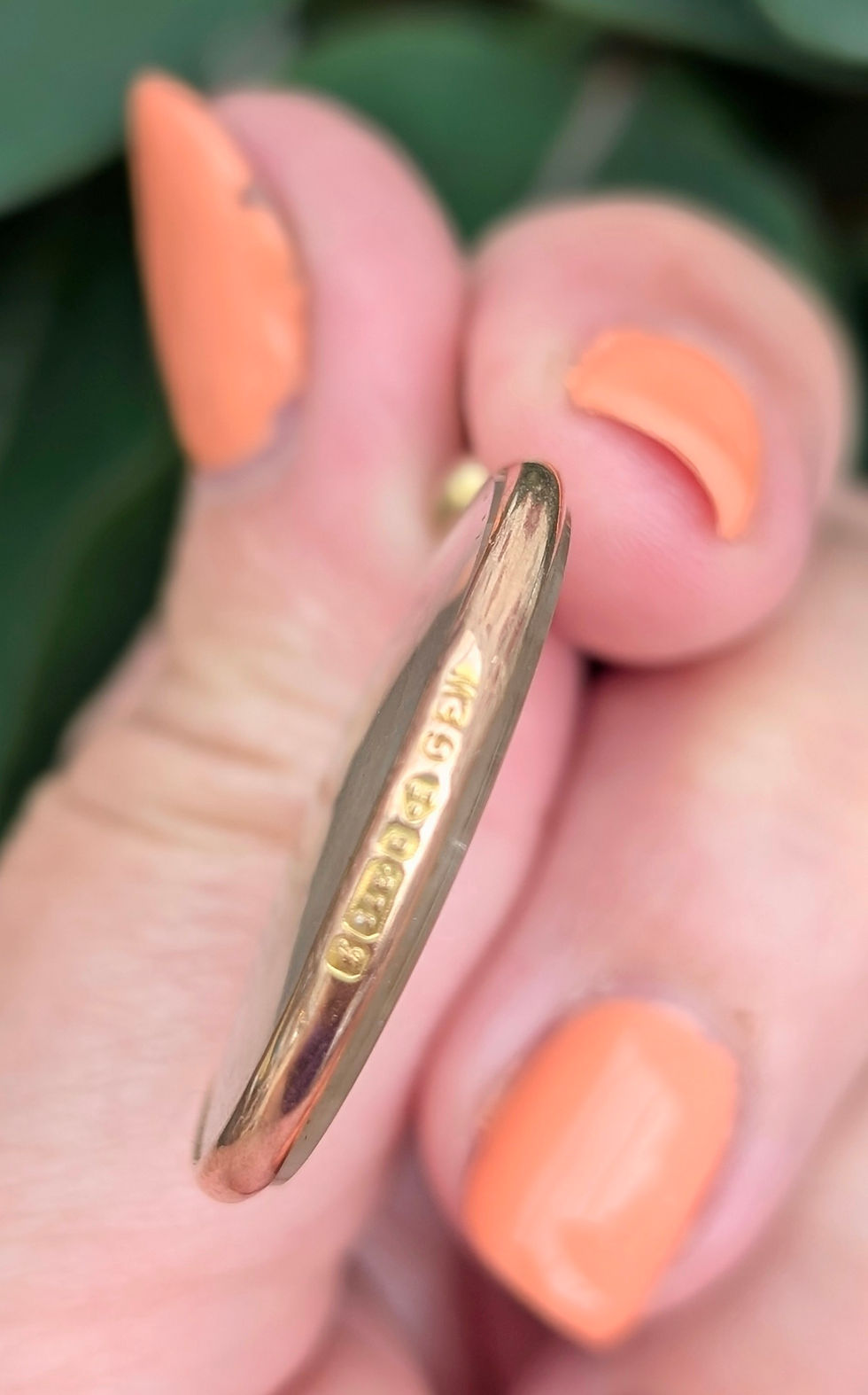 Thumbnail: a round double sided photo locket edged in yellow gold inside an image of an Edwardian lady