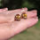 Thumbnail: 1960s oval faceted citrines with a deep golden colour bezel set in yellow gold stud earrings