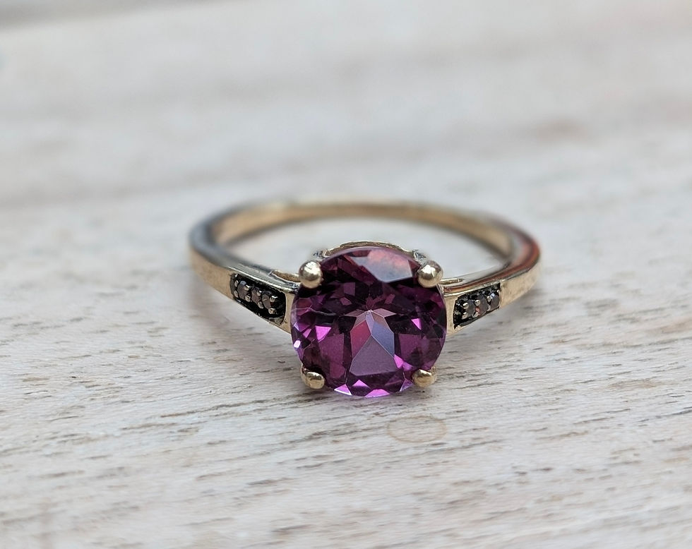 Thumbnail: 9ct gold ring with a round faceted vivid pink topaz