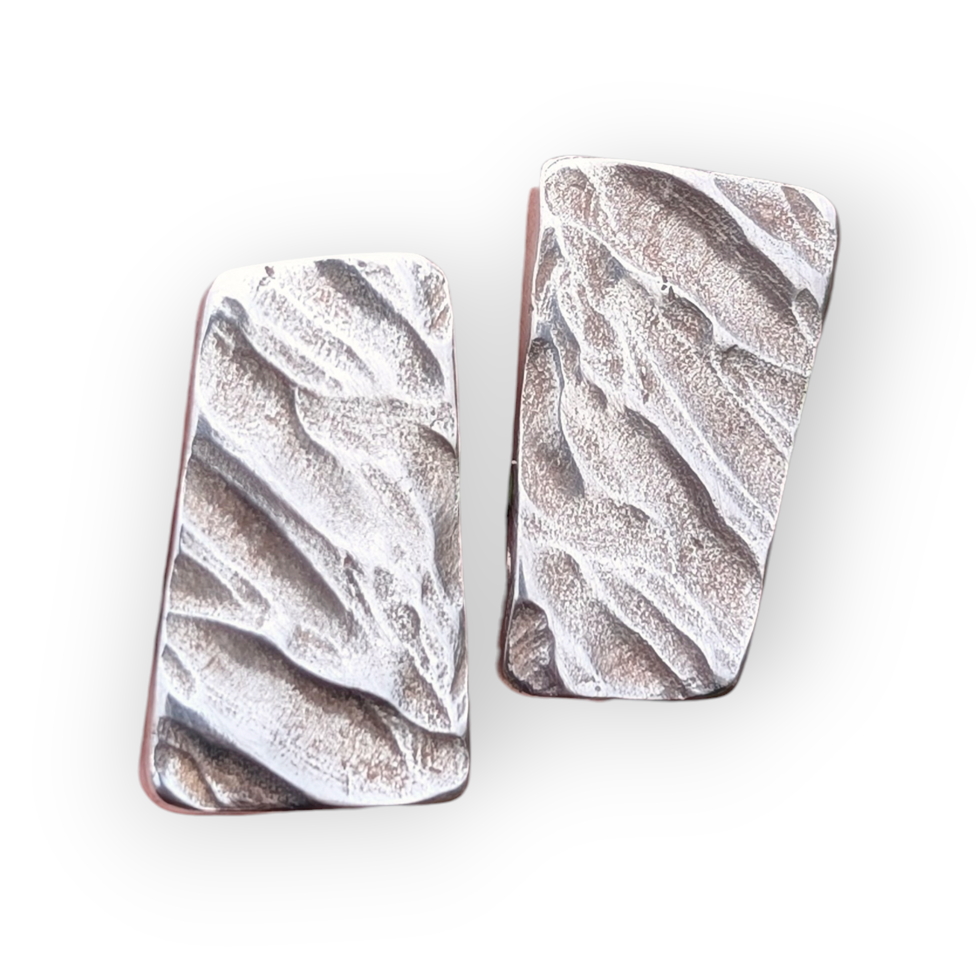 Stylish sterling silver cufflinks rectangular in shape feature a wonderful surface texture like ripples in wet sand