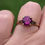 Thumbnail: 9ct gold ring with a round faceted vivid pink topaz