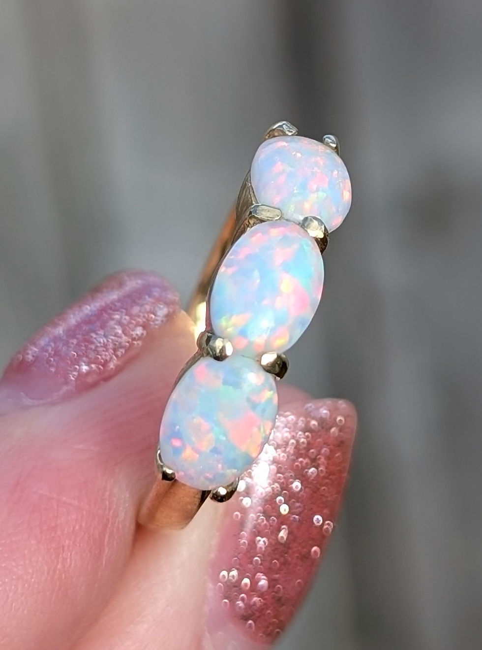 Thumbnail: vintage 14ct yellow gold ring set with three oval cabochons of precious white opal with amazing play of colour