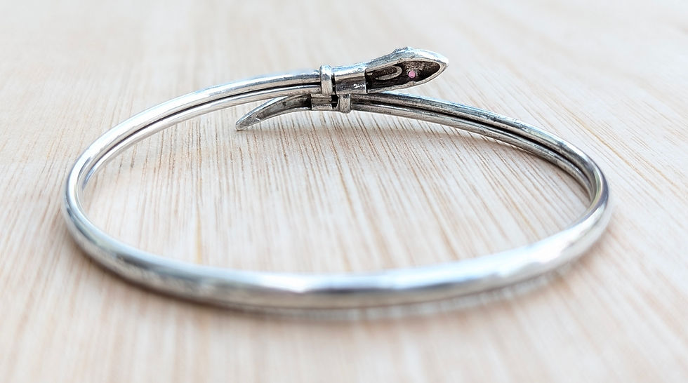 Thumbnail: An antique sterling silver snake with ruby eyes bangle