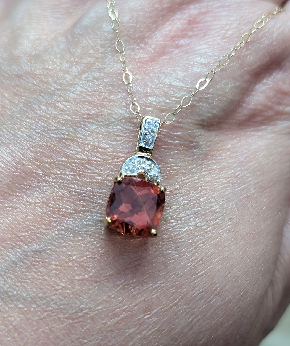 Thumbnail: yellow gold pendant set with a cushion cut red andesine gemstone and small round diamonds at the top