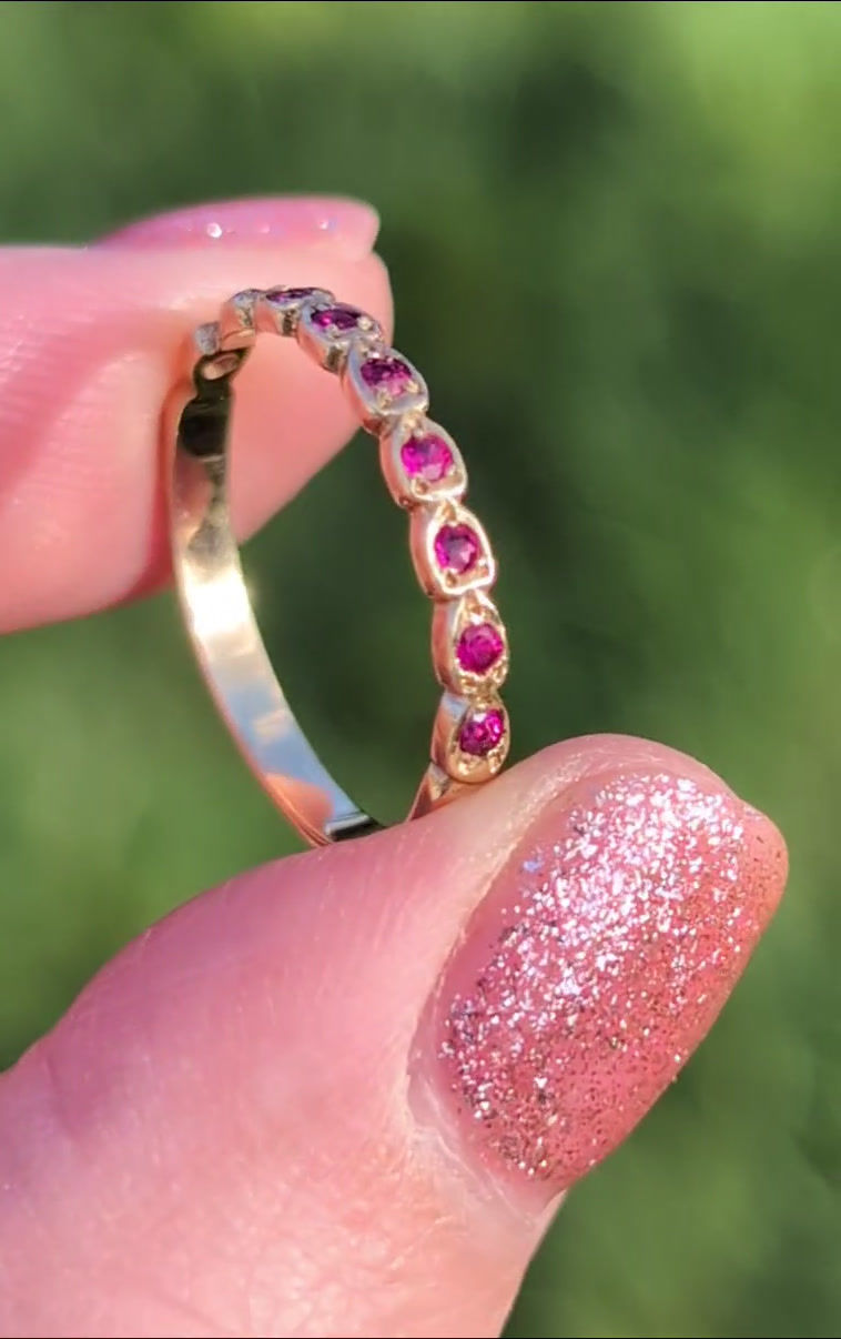 Thumbnail: vintage yellow gold half eternity ring set with rubies