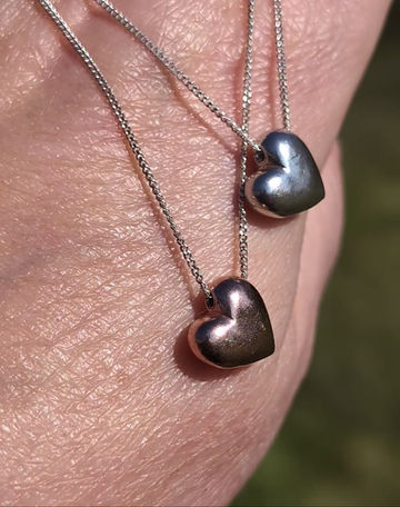 Thumbnail: a silver chain necklace with a suspended solid sterling silver heart charm
