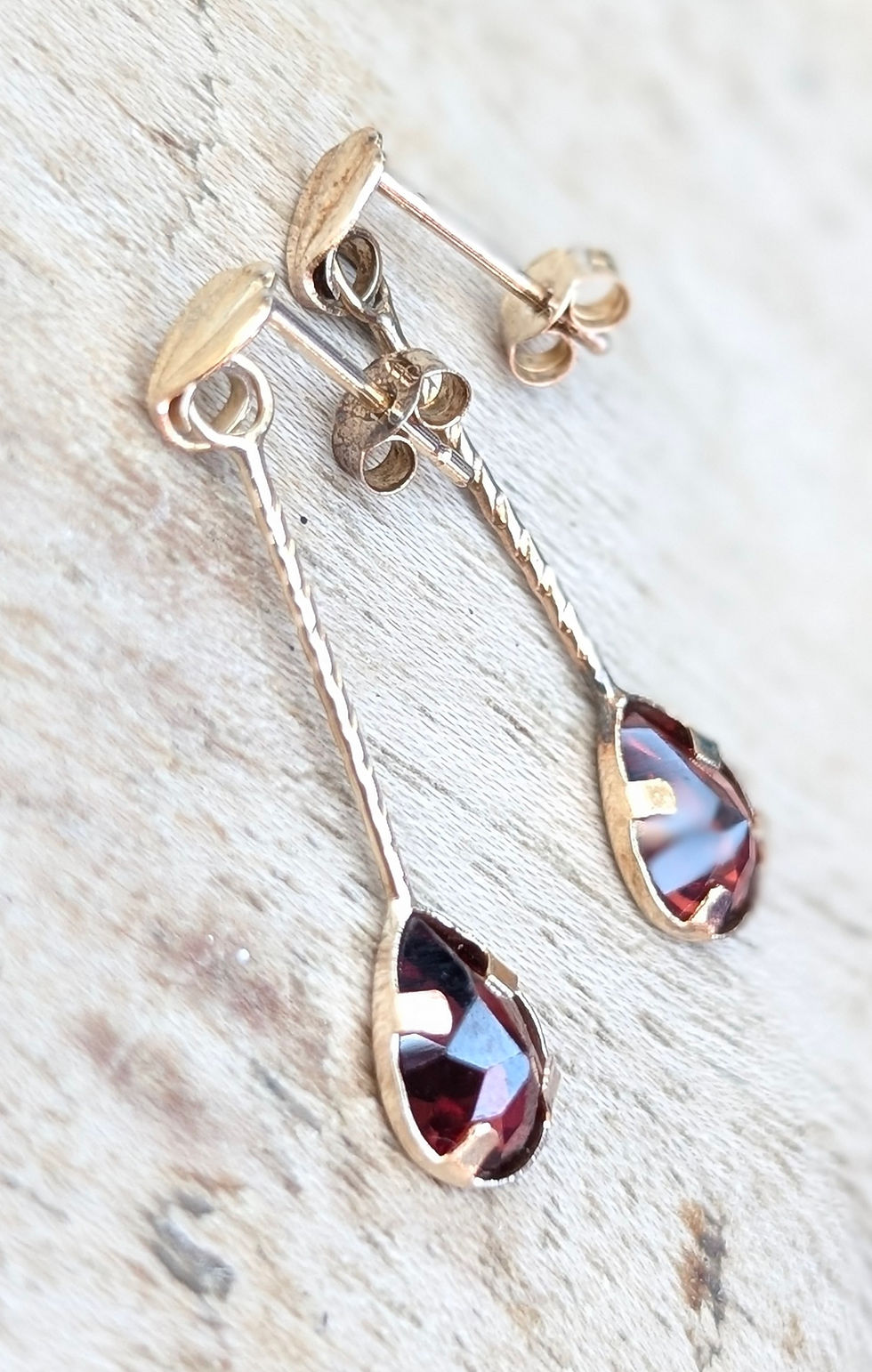 Thumbnail: vintage yellow gold drop earrings with pear shaped red garnets at the end