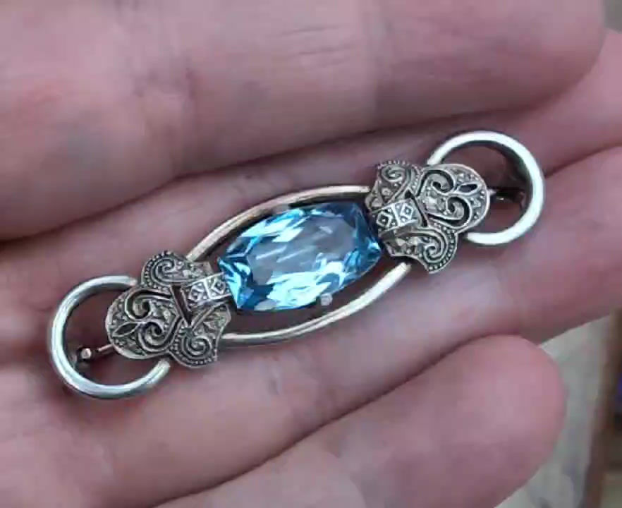Thumbnail: Antique art deco silver bar shape brooch set with a large vivid blue spinel