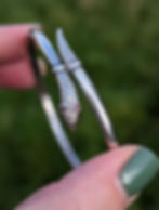 An antique sterling silver snake with ruby eyes bangle