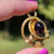 Thumbnail: victorian ornate 18ct yellow gold pendant with garnet cabochon