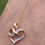 Thumbnail: vintage yellow and white gold heart shaped pendant with diamonds